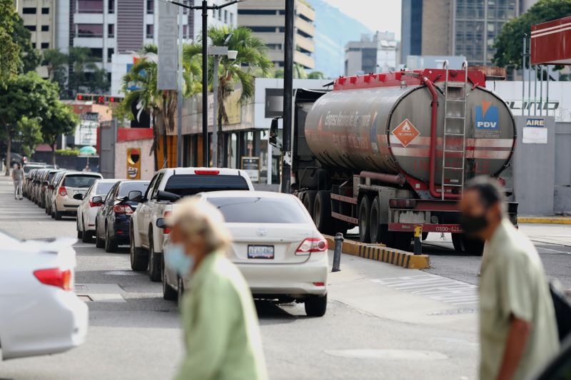 &copy; Reuters. FILE PHOTO: A gas truck is seen next to a line of cars in front of a gas station in Caracas