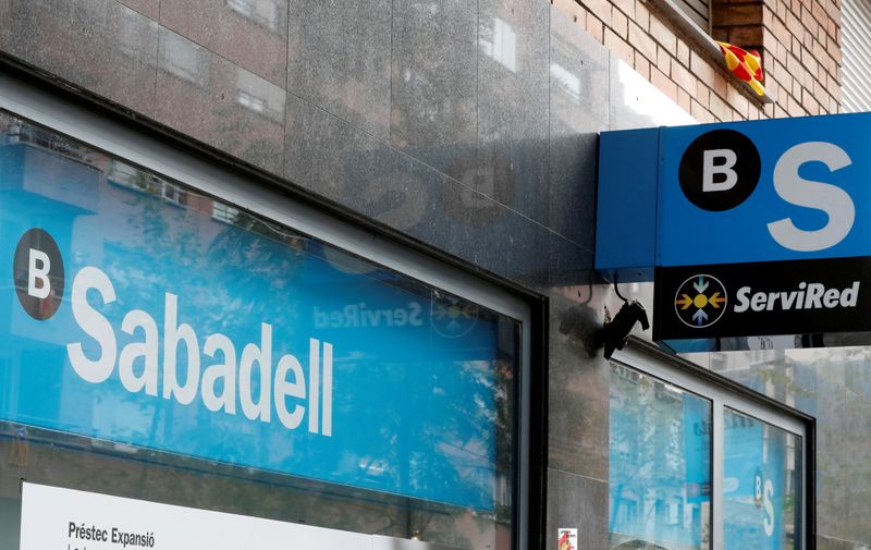 &copy; Reuters. FILE PHOTO: FILE PHOTO: A Catalan flag is seen above a logo at the Sabadell bank branch in Barcelona