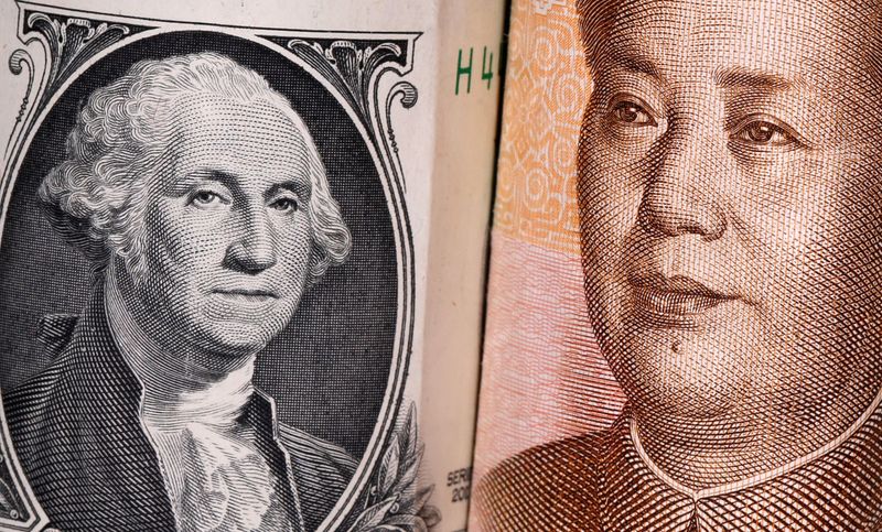 &copy; Reuters. Chinese Yuan and U.S. dollar banknotes are seen in this illustration