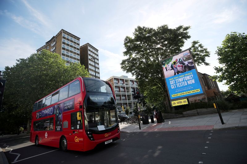 &copy; Reuters. FILE PHOTO: A government and NHS Test and Trace advert is seen on a billboard in London