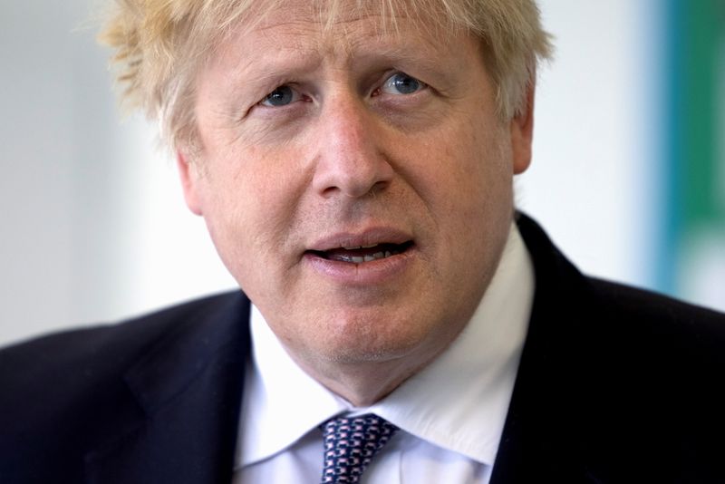 &copy; Reuters. FILE PHOTO: Britain&apos;s PM Johnson and finance minister Sunak visit school in London