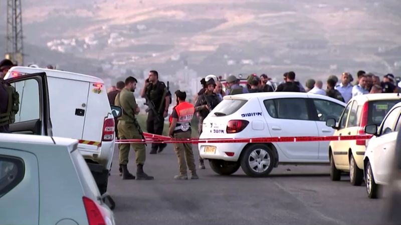 &copy; Reuters. Members of Israeli forces gather at the scene of a shooting incident in the Israeli-occupied West Bank