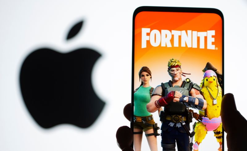 &copy; Reuters. Fortnite graphic and Apple logo displayed in illustration