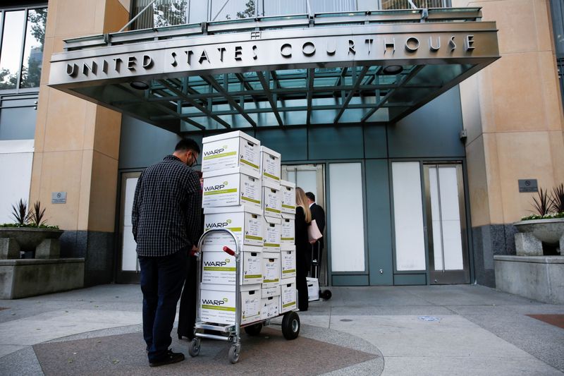 &copy; Reuters. Court documents provided by Gibson, Dunn and Crutcher, LLP, the law firm representing Apple, are brought to the Oakland Federal courthouse for a weeks-long antitrust trial at federal court in Oakland, California, U.S., May 3, 2021.  REUTERS/Brittany Hosea