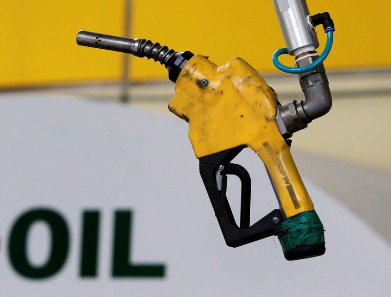 &copy; Reuters. FILE PHOTO: A gas pump is seen hanging from the ceiling at a petrol station in Seoul