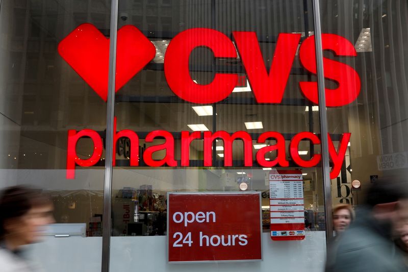 &copy; Reuters. FILE PHOTO: People walk by a CVS Pharmacy store in the Manhattan borough of New York City, New York, U.S., November 30, 2017. REUTERS/Shannon Stapleton