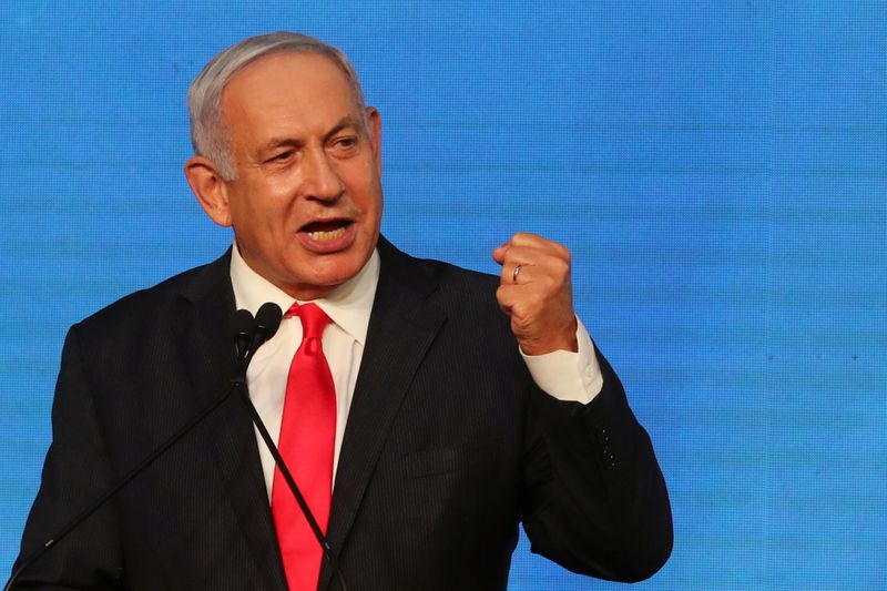 &copy; Reuters. Israeli Prime Minister Benjamin Netanyahu gestures as he delivers a speech to supporters following the announcement of exit polls in Israel&apos;s general election at his Likud party headquarters in Jerusalem