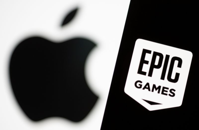 &copy; Reuters. Smartphone with Epic Games logo is seen in front of Apple logo in this illustration