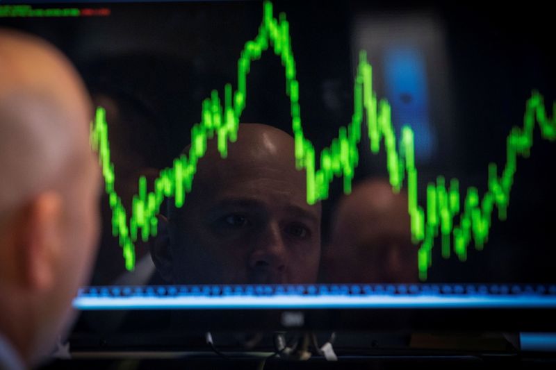 &copy; Reuters. FILE PHOTO: A specialist trader watches his chart while working on the floor of the New York Stock Exchange July 8, 2014.     REUTERS/Brendan McDermid/File Photo/File Photo