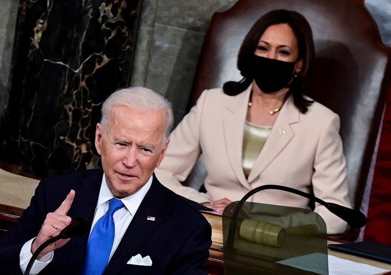 &copy; Reuters. U.S. President Joe Biden addresses a joint session of Congress as U.S. Vice President Kamala Harris looks on at the U.S. Capitol in Washington, U.S., April 28, 2021.  Jim Watson/Pool via REUTERS