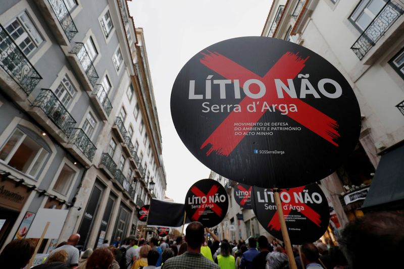 © Reuters. FILE PHOTO: Demonstrators protest against lithium mines in downtown Lisbon, Portugal September 21, 2019. The placards read 