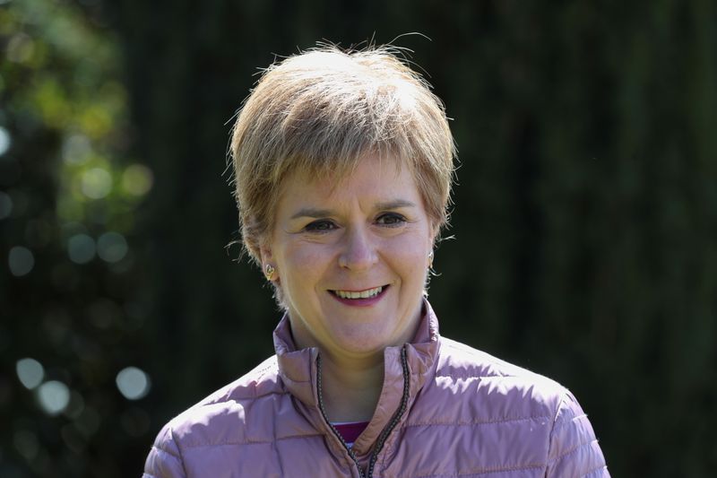 © Reuters. Scottish First Minister Nicola Sturgeon looks on as she campaigns for the parliamentary elections in Alford, Scotland, Britain, May 5, 2021. REUTERS/Russell Cheyne/Pool