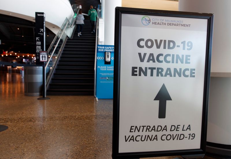 &copy; Reuters. FILE PHOTO: May 2, 2021; Milwaukee, Wisconsin, USA; A sign directing fans where to receive a COVID-19 vaccination prior to the game between the Milwaukee Bucks and the Brooklyn Netsat Fiserv Forum. Mandatory Credit: Jeff Hanisch-USA TODAY Sports
