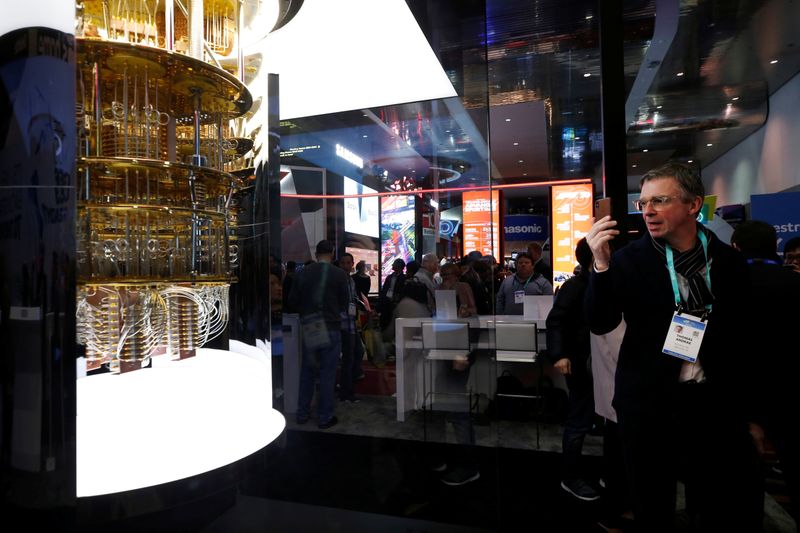 &copy; Reuters. A man takes a photo of a model of the IBM Q System One quantum computer during the 2020 CES in Las Vegas