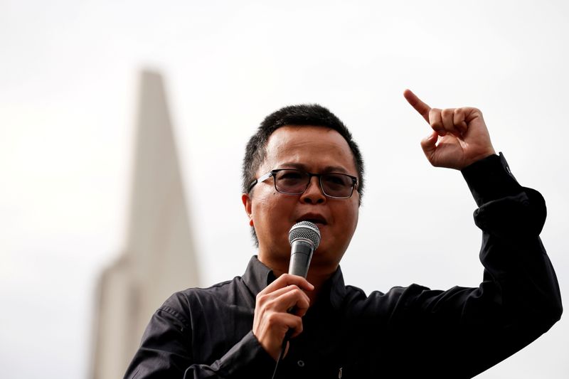 &copy; Reuters. FILE PHOTO: Human rights lawyer Arnon Nampa speaks during a Thai anti-government mass protest, on the 47th anniversary of the 1973 student uprising, in front of the Democracy monument, in Bangkok, Thailand October 14, 2020. REUTERS/Soe Zeya Tun