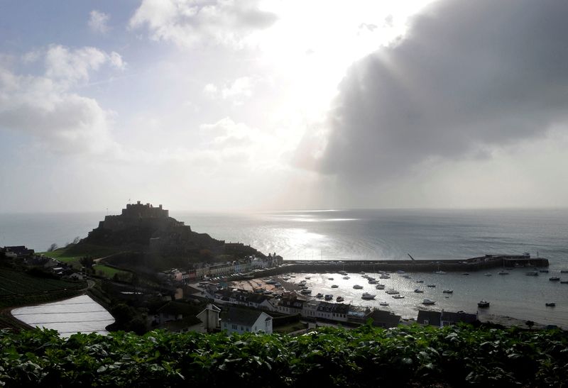 &copy; Reuters. FILE PHOTO: The village of Gorey Harbour and Mont Orgueil castle are seen in Jersey in this March 1, 2008 file photo./Toby Melville