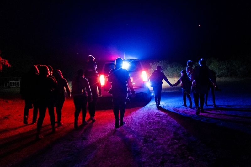&copy; Reuters. Asylum-seeking migrant families walk while being escorted by the U.S. Border Patrol after crossing the Rio Grande river into the United States from Mexico, in Roma, Texas, U.S. May 6, 2021. REUTERS/Go Nakamura