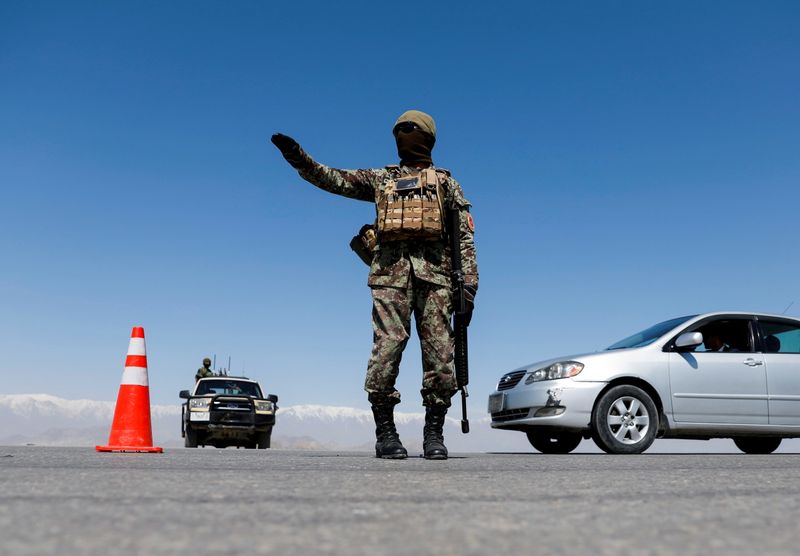 &copy; Reuters. FILE PHOTO: An Afghan National Army soldier stands guard at a checkpoint on the outskirts of Kabul, Afghanistan April 21, 2021. REUTERS/Mohammad Ismail/File Photo