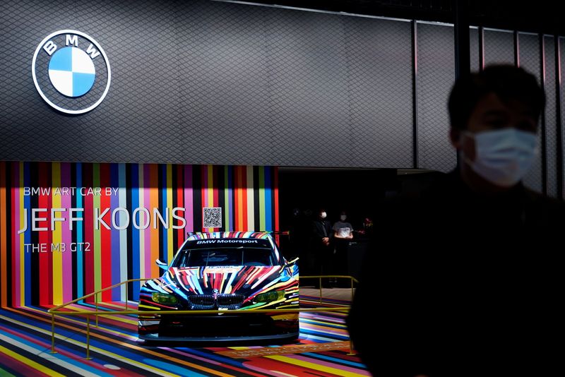 &copy; Reuters. FILE PHOTO: A staff member stands near a BMW M3 GT2 vehicle displayed at the BMW booth during a media day for the Auto Shanghai show in Shanghai, China April 19, 2021. REUTERS/Aly Song