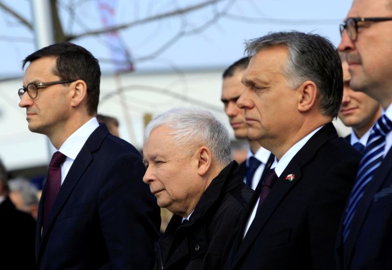&copy; Reuters. FILE PHOTO: Polish Prime Minister Morawiecki, leader of the ruling party Law and Justice, Jaroslaw Kaczynski and Hungarian Prime Minister Orban attend the consecration of the statue in memory of Smolensk plane crash victims in Budapest