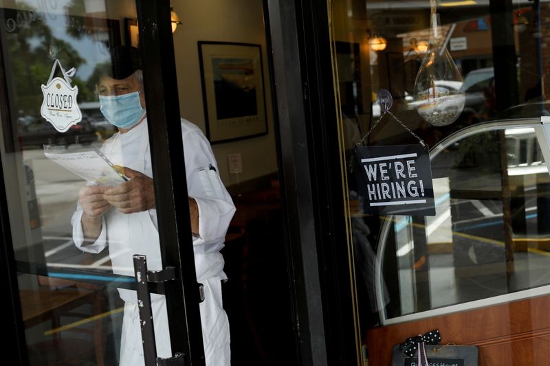 &copy; Reuters. FILE PHOTO: A "We're Hiring" sign advertising jobs is seen at the entrance of a restaurant, as Miami-Dade County eases some of the lockdown measures put in place during the coronavirus disease (COVID-19) outbreak, in Miami, Florida, U.S., May 18, 2020. RE
