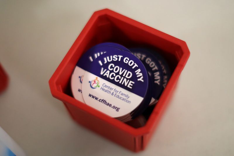 &copy; Reuters. FILE PHOTO: Stickers that are given to people who have been vaccinated against the coronavirus disease (COVID-19) are pictured in Los Angeles, California, U.S., April 12, 2021. REUTERS/Lucy Nicholson