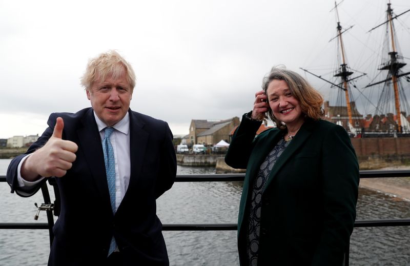 © Reuters. Britain's Prime Minister Boris Johnson and newly elected MP for Hartlepool Jill Mortimer pose for a photo at Jacksons Wharf Marina in Hartlepool following local elections, Britain, May 7, 2021. REUTERS/Lee Smith