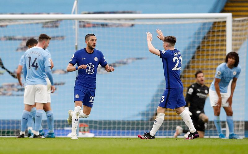 &copy; Reuters. Soccer Football - Premier League - Manchester City v Chelsea - Etihad Stadium, Manchester, Britain - May 8, 2021 Chelsea's Hakim Ziyech celebrates scoring their first goal with Billy Gilmour Pool via REUTERS/Martin Rickett 