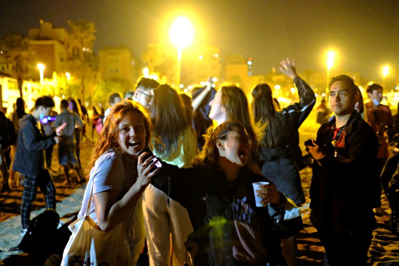 Spaniards party as COVID curfew ends but doubts remain