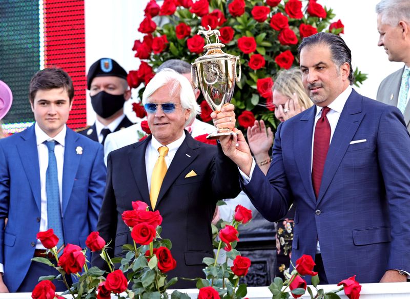 &copy; Reuters. May 1, 2021; Louisville, Kentucky, USA; Medina Spirit owner Amr F. Zedan (right) and trainer Bob Baffert hold the trophy after winning the 147th running of the Kentucky Derby at Churchill Downs. Mandatory Credit: Jim Owens-USA TODAY Sports
