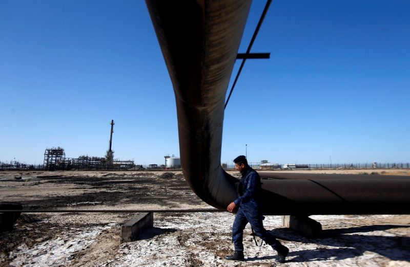 &copy; Reuters. FILE PHOTO: A policeman walks at West Qurna-1 oil field, which is operated by ExxonMobil, in Basra, Iraq, January 9, 2020. REUTERS/Essam al-Sudani/File Photo