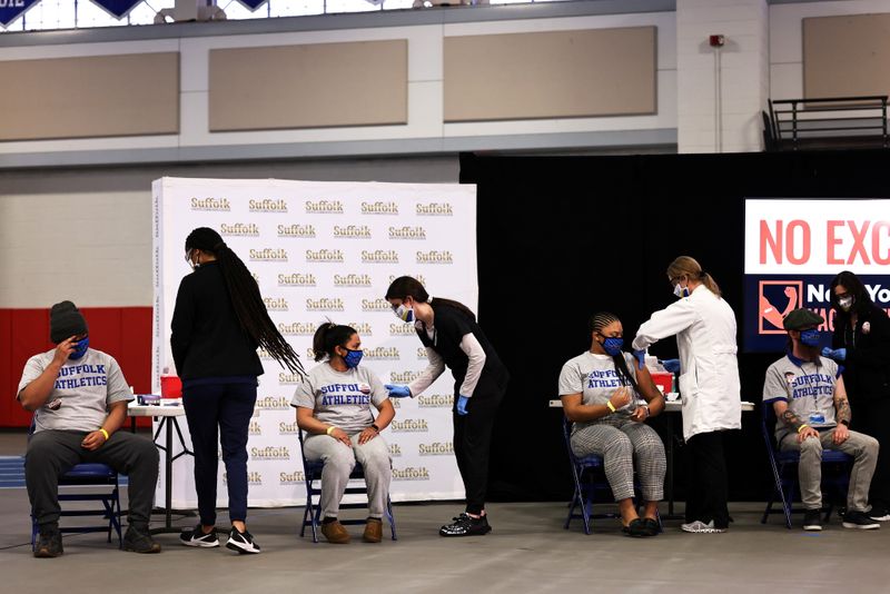 &copy; Reuters. FILE PHOTO: Students from Suffolk County Community College prepare to get vaccinated during a news conference on COVID-19 vaccination at Suffolk County Community College in Brentwood, New York, U.S. April 12, 2021. Michael M. Santiago/Pool via REUTERS