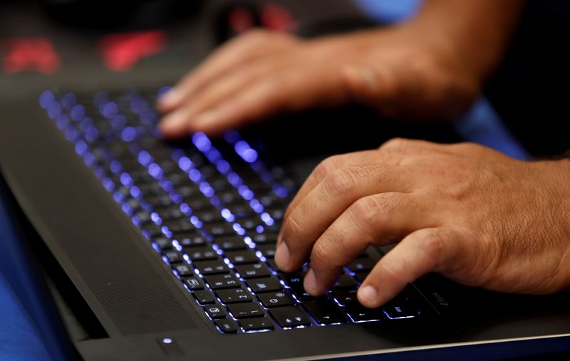 &copy; Reuters. A man types into a keyboard during the Def Con hacker convention in Las Vegas, Nevada, U.S. on July 29, 2017. REUTERS/Steve Marcus - RC1DDD0E29A0