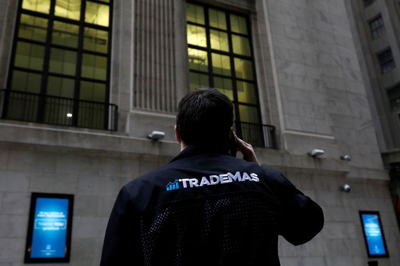 &copy; Reuters. Trader Frank Masiello talks on his phone on Wall St. outside the New York Stock Exchange (NYSE) in New York, U.S., January 15, 2021. REUTERS/Brendan McDermid