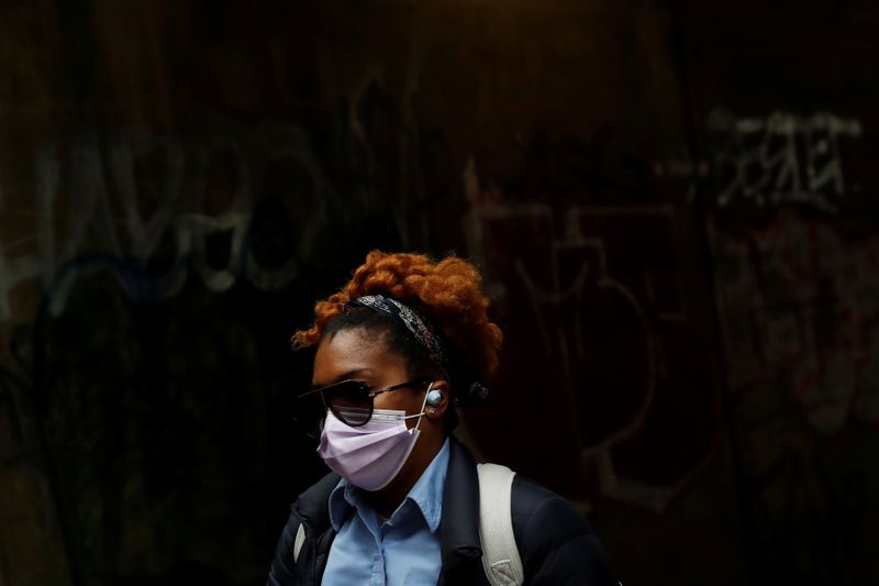 &copy; Reuters. Woman walks under the subway in Brownsville section of the Brooklyn borough of New York City