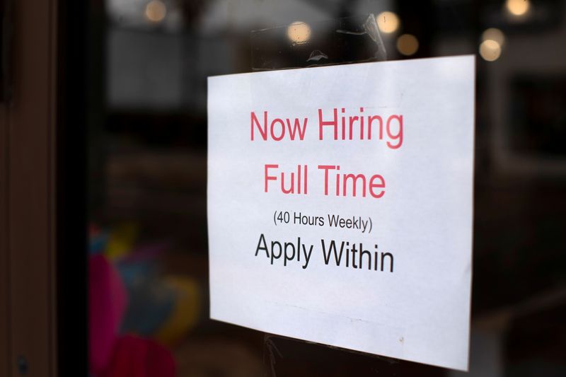 © Reuters. FILE PHOTO: A retail store advertising a full time job on its shop window in Oceanside, California, U.S., May 10, 2021. REUTERS/Mike Blake/File Photo