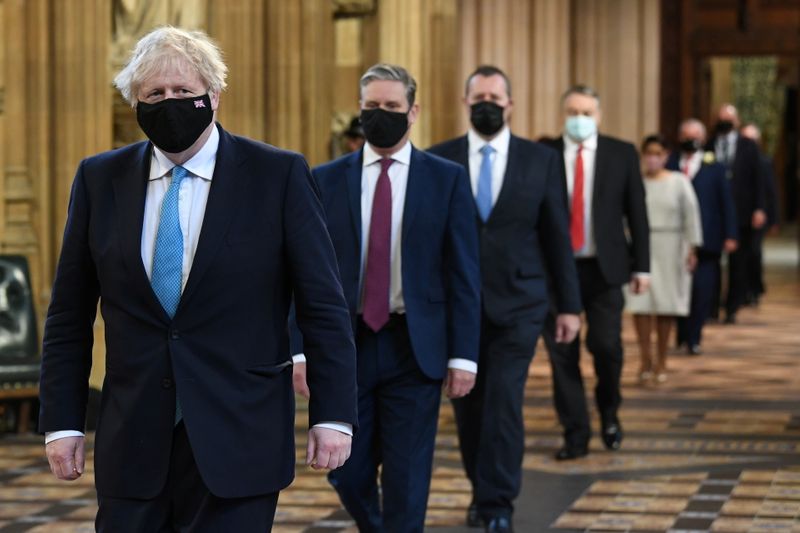 © Reuters. British Prime Minister Boris Johnson and Labour leader Keir Starmer (2-L) walk through the Central Lobby on the way to the House of Lords to listen to the Queen's Speech during the State Opening of Parliament in London, Britain May 11, 2021. Stefan Rousseau/PA Wire/Pool via REUTERS