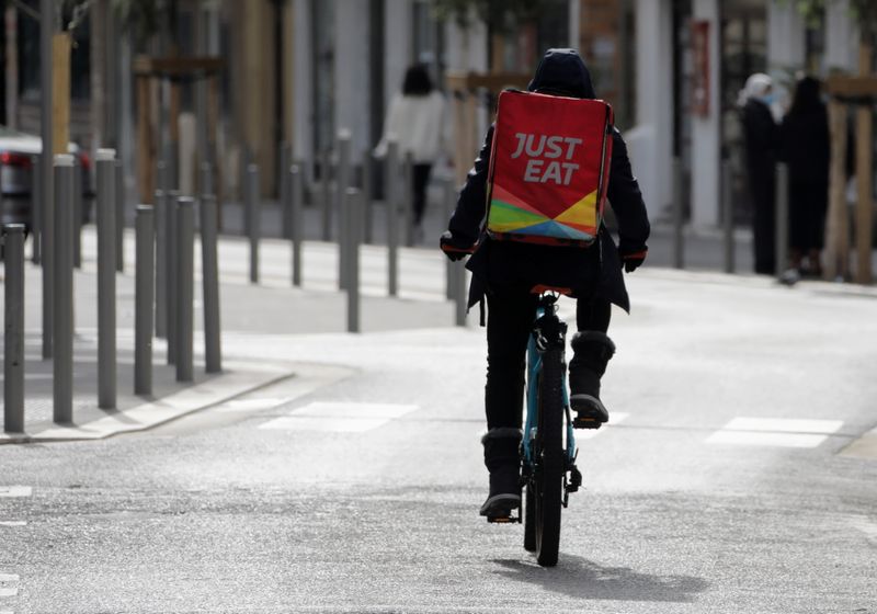 &copy; Reuters. A Just Eat delivery man rides his bicycle in Nice