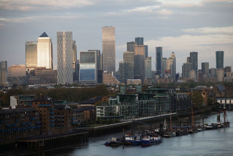 &copy; Reuters. FILE PHOTO: Skyscrapers in The City of London financial district are seen from City Hall in London, Britain, May 8, 2021. REUTERS/Henry Nicholls/File Photo