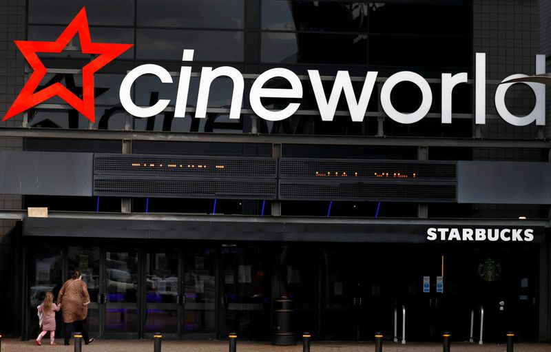 &copy; Reuters. FILE PHOTO: People enter a Cineworld cinema following the outbreak of the coronavirus disease near Manchester, Britain, October 4, 2020. REUTERS/Phil Noble/File Photo/File Photo