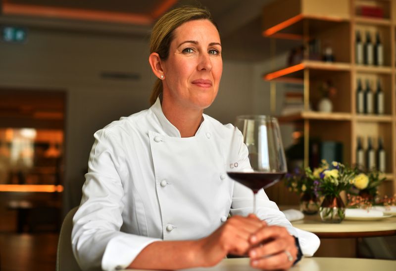 &copy; Reuters. Britain's newest winner of three Michelin stars, Clare Smyth sits at her Core restaurant, which sold out three months of bookings in 20 minutes, as the country reopens following the coronavirus disease (COVID-19) outbreak, in London, Britain, May 12, 2021