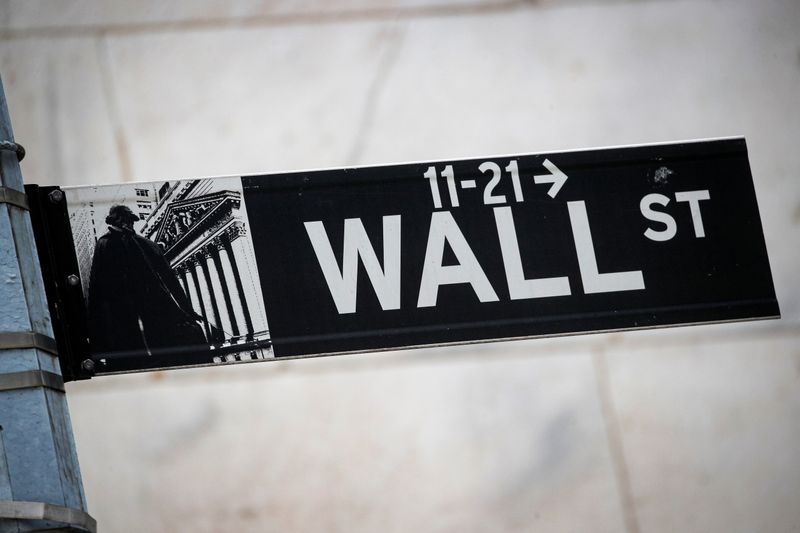 &copy; Reuters. The Wall St. sign is seen outside The New York Stock Exchange (NYSE) in New York, U.S., March 1, 2021. REUTERS/Brendan McDermid