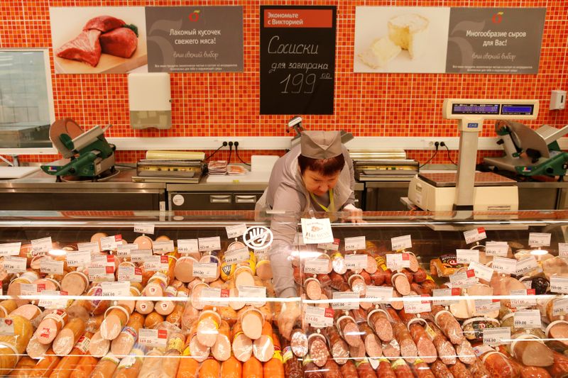 &copy; Reuters. A worker arranges sausages at a Victoria supermarket operated by Russian food retailer Dixy Group in Moscow, Russia, October 20, 2016. REUTERS/Maxim Zmeyev