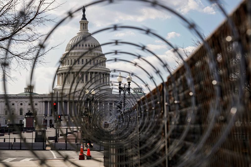 &copy; Reuters. FILE PHOTO: The U.S. Capitol is seen through razor wire after police warned that a militia group might try to attack the U.S. Capitol in Washington, U.S., March 4, 2021. REUTERS/Joshua Roberts/File Photo
