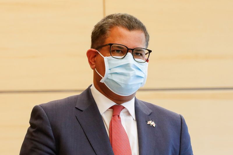 &copy; Reuters. FILE PHOTO: COP26 President Alok Sharma wearing a face mask waits to meet Japan's Prime Minister Yoshihide Suga at the prime minister's official residence in Tokyo, Japan April 19, 2021. Rodrigo Reyes Marin/Pool via REUTERS/File Photo