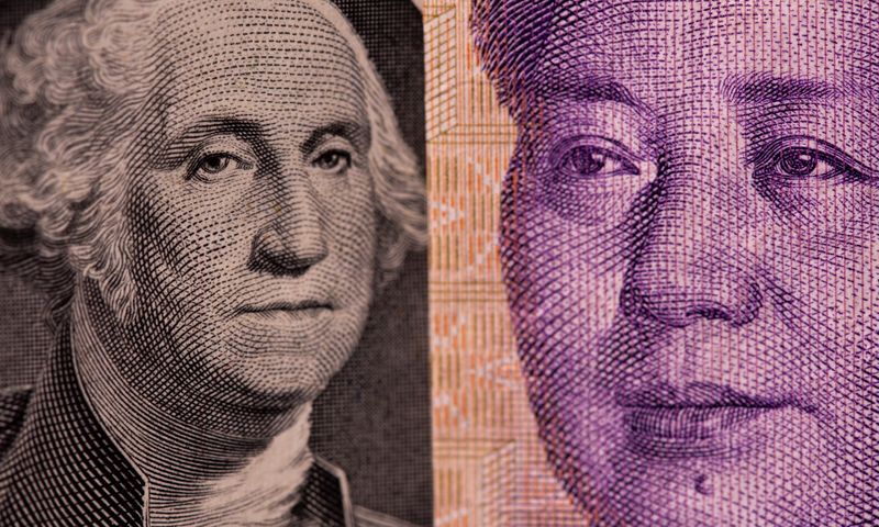 &copy; Reuters. FILE PHOTO: U.S. one dollar and Chinese Yuan are seen in this illustration taken May 7, 2021. REUTERS/Dado Ruvic/Illustration