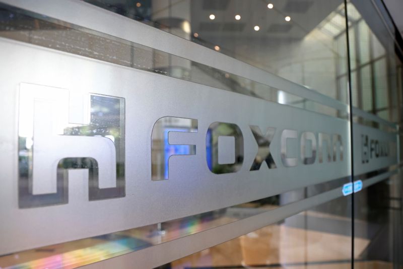 &copy; Reuters. Sign of Foxconn is seen at a glass door inside its office building in Taipei