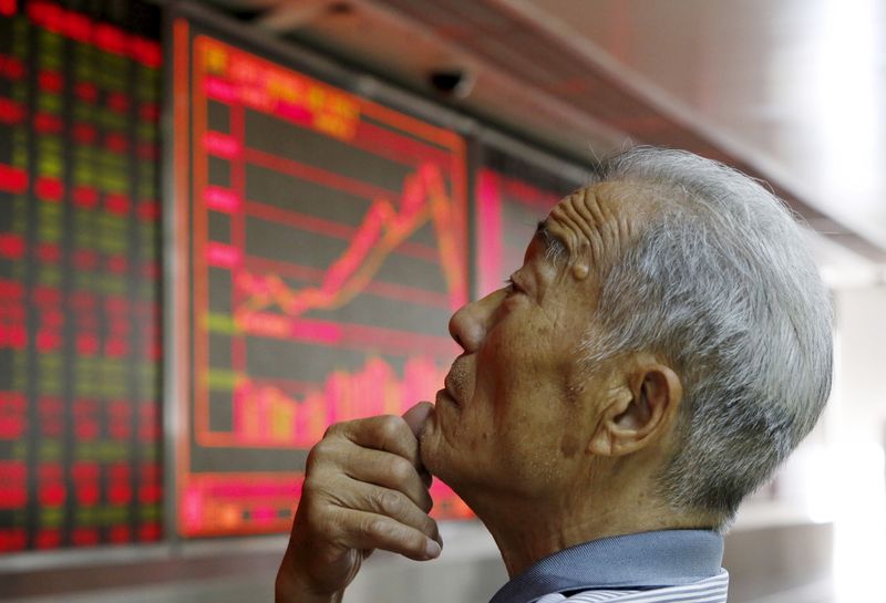 &copy; Reuters. An investor watches an electronic board showing stock information at a brokerage office in Beijing, China, July 9, 2015. China shares rebounded sharply on Thursday, with the Shanghai Composite index posting its biggest percentage gain in six years, as a f