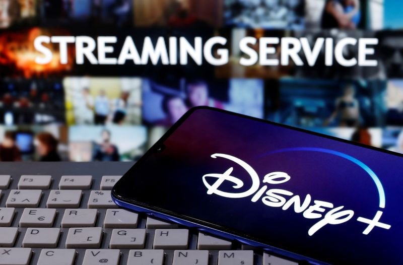 &copy; Reuters. FILE PHOTO: A smartphone with the "Disney" logo is seen on a keyboard in front of the words "Streaming service" in this picture illustration taken March 24, 2020. REUTERS/Dado Ruvic/File Photo