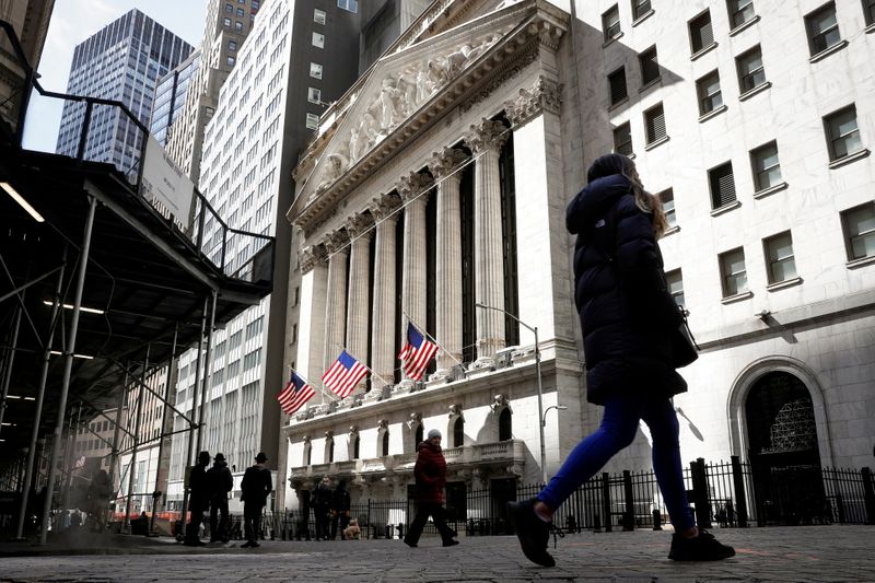 &copy; Reuters. FILE PHOTO: People are seen on Wall Street outside the NYSE in New York